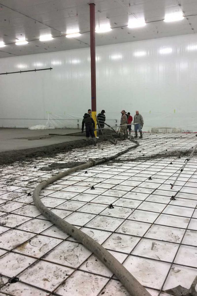 Pouring concrete for Delta freezer floor
